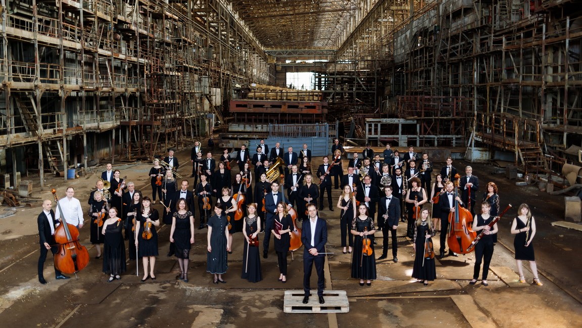 Musicians of the Kyiv Symphony standing on stage prior to the Russian invasion of Ukraine.